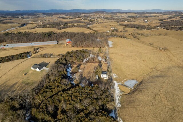 drone / aerial view featuring a rural view and a mountain view