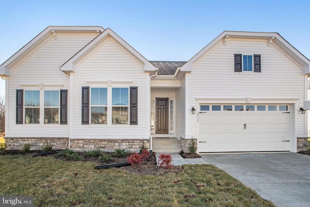 view of front of home featuring a garage and a front lawn