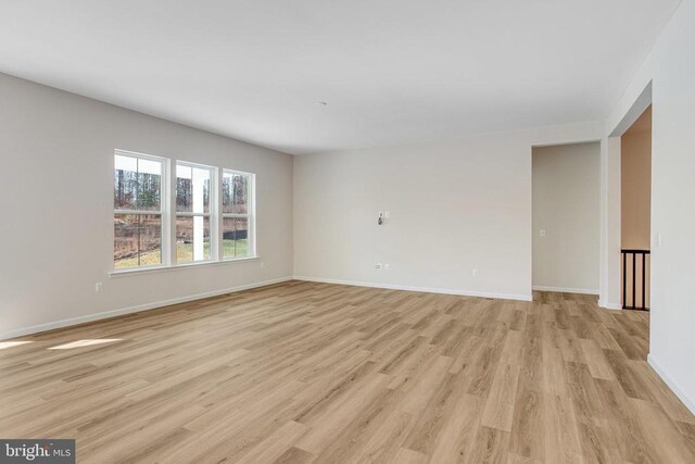 empty room with light hardwood / wood-style floors