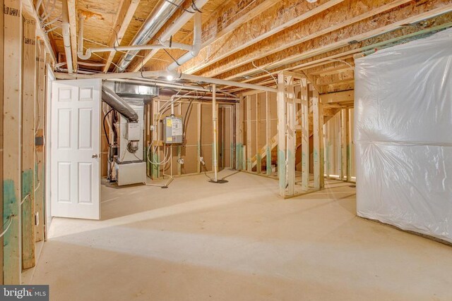 basement with heating unit and water heater