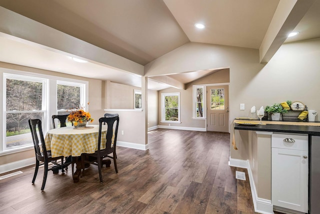 dining room featuring baseboards, dark wood-style flooring, vaulted ceiling, and visible vents