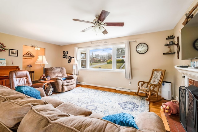 living room featuring ceiling fan and wood-type flooring