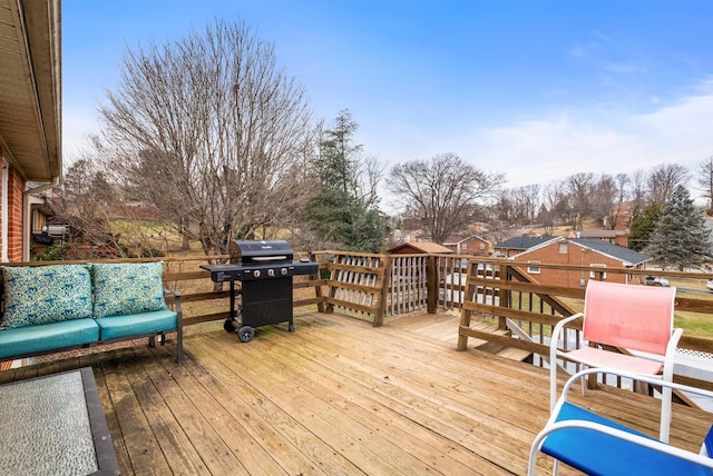 deck with area for grilling and an outdoor hangout area