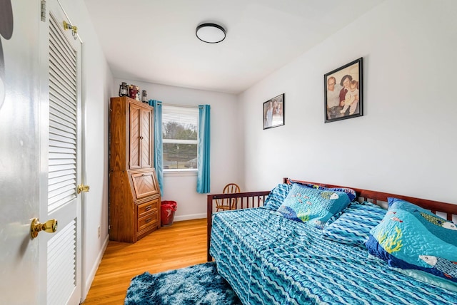 bedroom with hardwood / wood-style floors