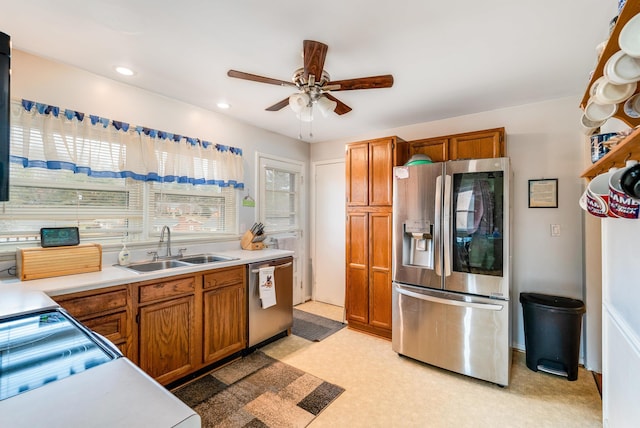 kitchen featuring sink, stainless steel appliances, and ceiling fan