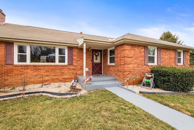 ranch-style house with a front lawn