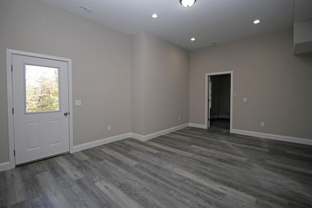 spare room with dark hardwood / wood-style floors