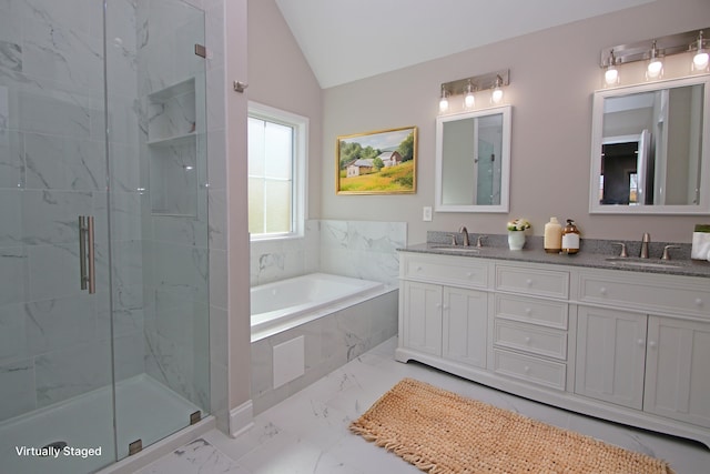 bathroom with lofted ceiling, vanity, and shower with separate bathtub