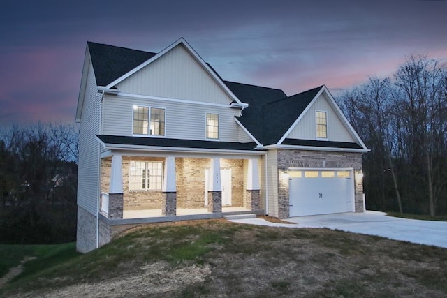 view of front of house featuring a garage and covered porch