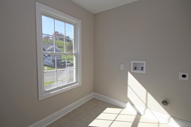 laundry area with washer hookup, light tile patterned floors, and electric dryer hookup