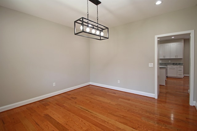 unfurnished dining area featuring light hardwood / wood-style flooring