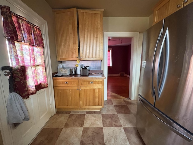 kitchen with freestanding refrigerator