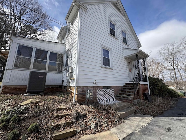 view of side of home with cooling unit