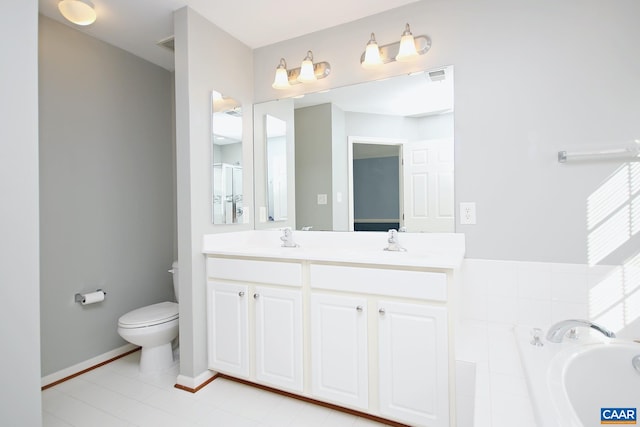 full bathroom featuring toilet, a garden tub, double vanity, and a sink