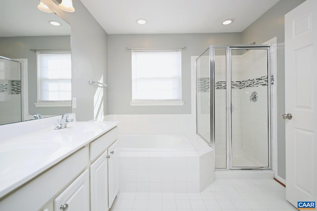 bathroom with a shower stall, a garden tub, tile patterned floors, and a sink