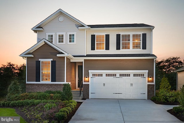 view of front of property with a garage