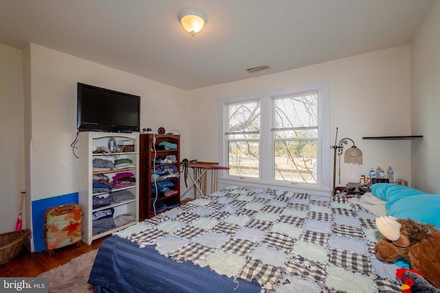 bedroom with wood-type flooring