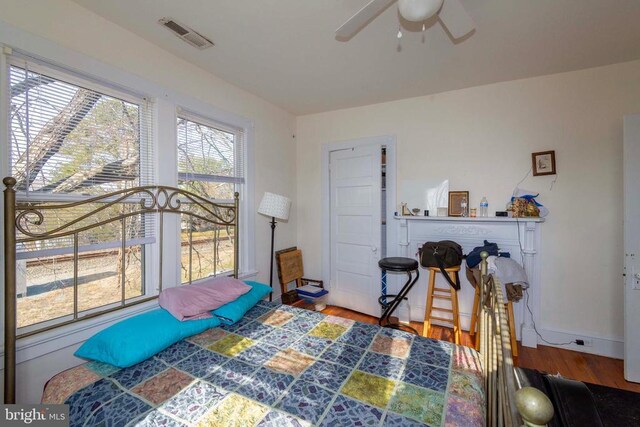 bedroom with hardwood / wood-style floors