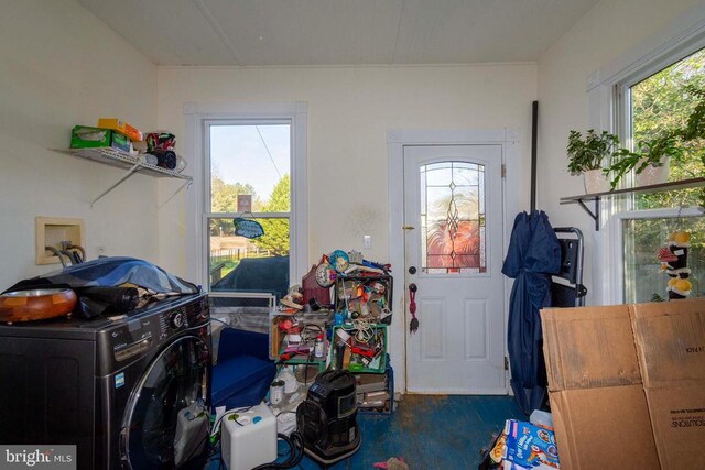 clothes washing area with washer / dryer