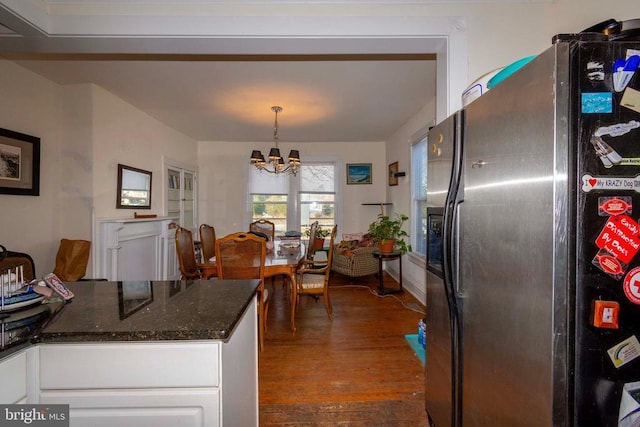 kitchen with decorative light fixtures, white cabinets, a chandelier, dark hardwood / wood-style flooring, and stainless steel refrigerator with ice dispenser