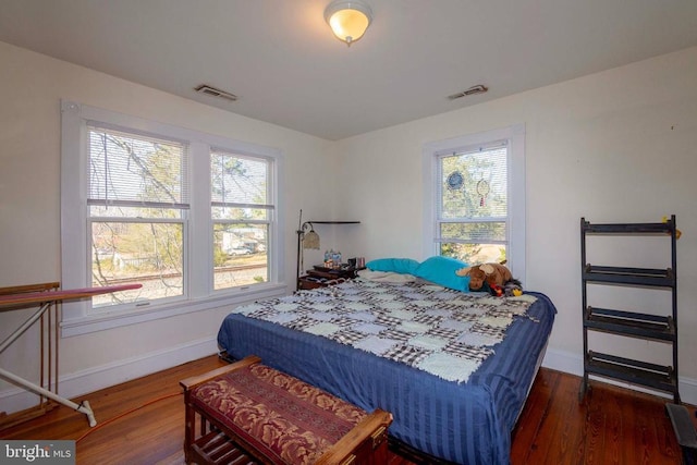 bedroom featuring dark hardwood / wood-style flooring