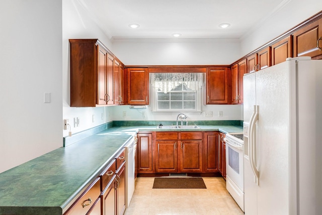 kitchen featuring white appliances, ornamental molding, and sink