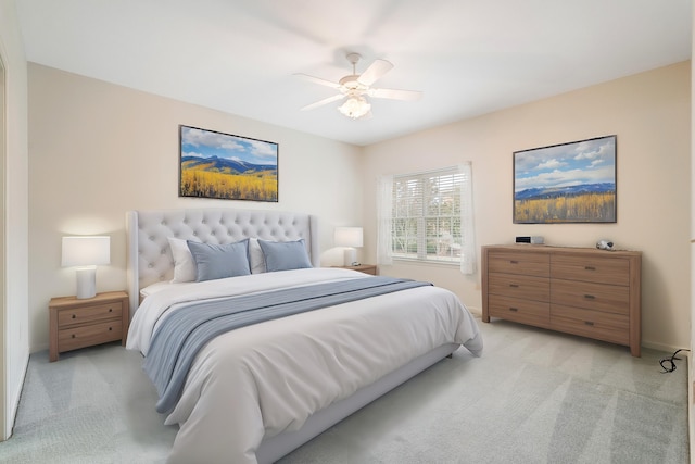 bedroom with light colored carpet and ceiling fan