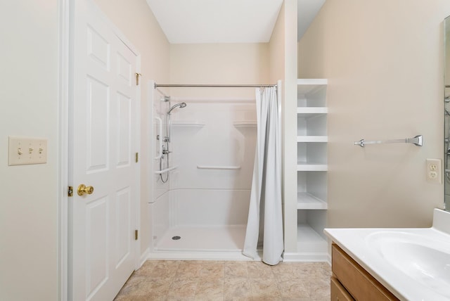 bathroom with vanity and a shower with shower curtain