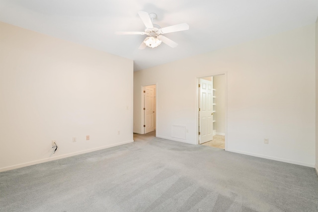 unfurnished room with light carpet and ceiling fan