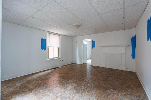 spare room with a paneled ceiling