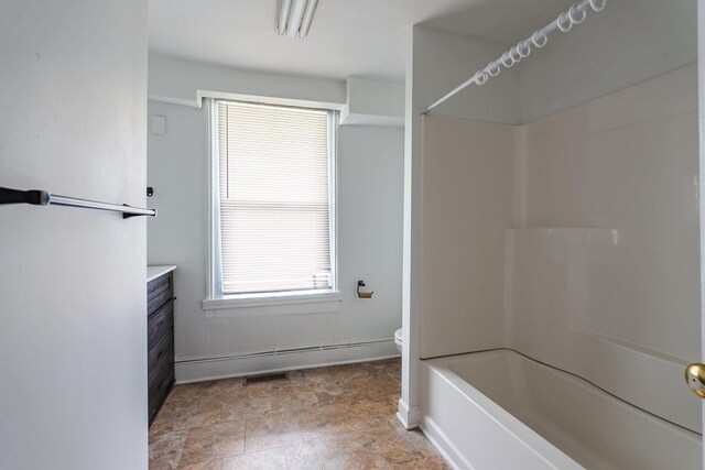 full bathroom featuring vanity, bathing tub / shower combination, and toilet