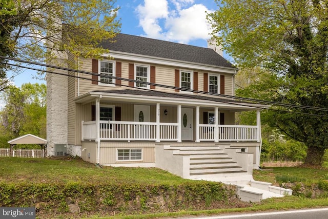 view of front facade with a porch and a front yard