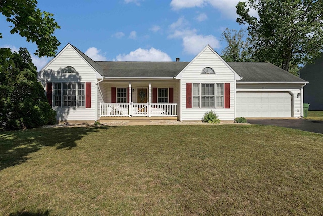 single story home featuring a garage, covered porch, a front lawn, and aphalt driveway