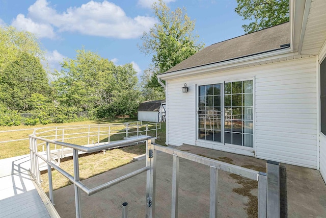 exterior space with an outbuilding and a storage unit