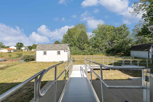 exterior space featuring fence and a yard