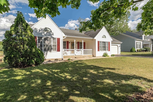 view of front facade with a porch, a garage, aphalt driveway, and a front lawn