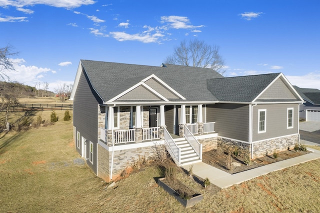 view of front facade with a porch and a front lawn