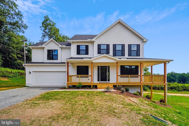 view of front facade featuring gravel driveway, a porch, an attached garage, and a front yard