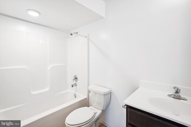 bathroom with vanity, toilet, and shower / bath combination