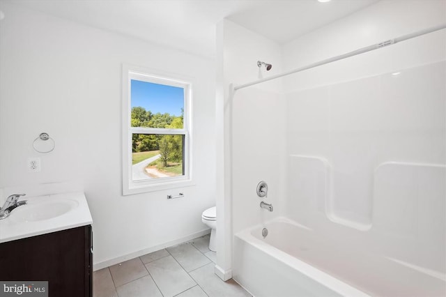 full bathroom with vanity, baseboards, bathtub / shower combination, tile patterned floors, and toilet