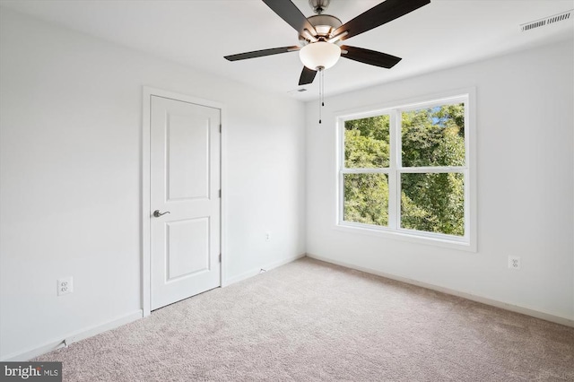 unfurnished bedroom featuring ceiling fan, carpet, visible vents, and baseboards