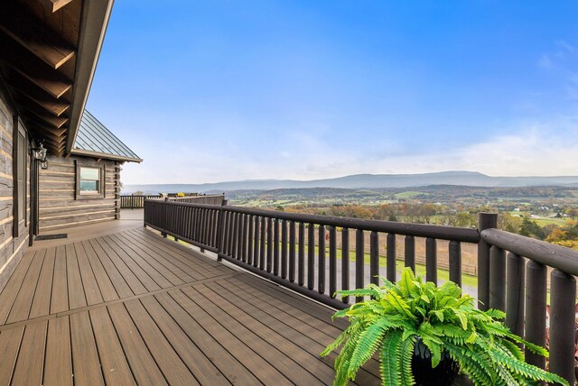 wooden deck featuring a mountain view