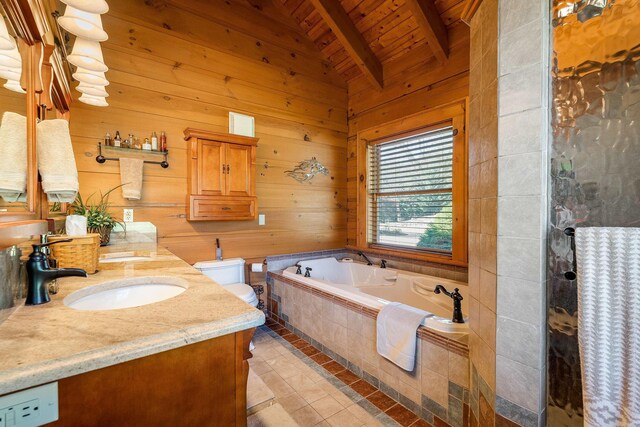 bathroom with toilet, vaulted ceiling with beams, wood ceiling, vanity, and a relaxing tiled tub