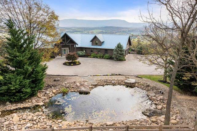 rear view of house with a mountain view