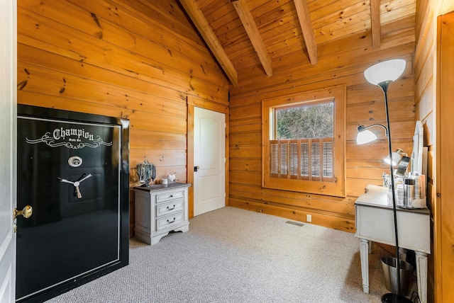 interior space with carpet floors, wooden walls, lofted ceiling with beams, and wooden ceiling