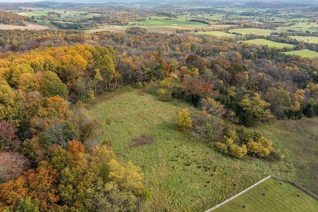 birds eye view of property featuring a rural view