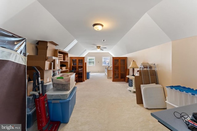 bonus room with vaulted ceiling, carpet floors, and a ceiling fan