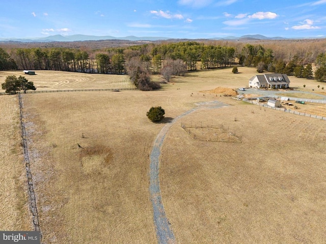 aerial view featuring a rural view, a mountain view, and a forest view