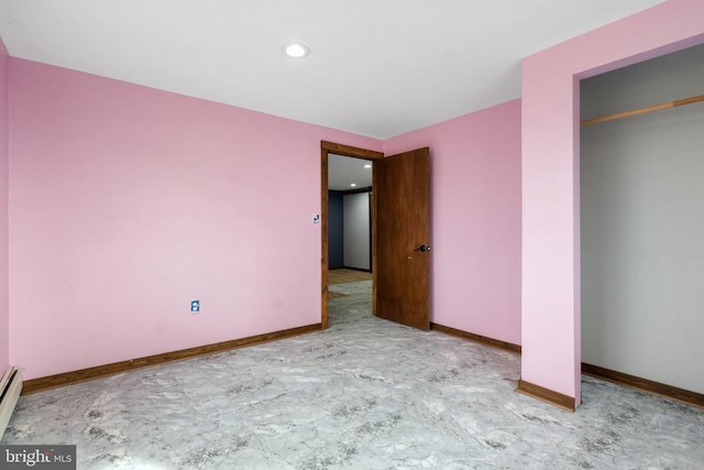 unfurnished bedroom with baseboard heating