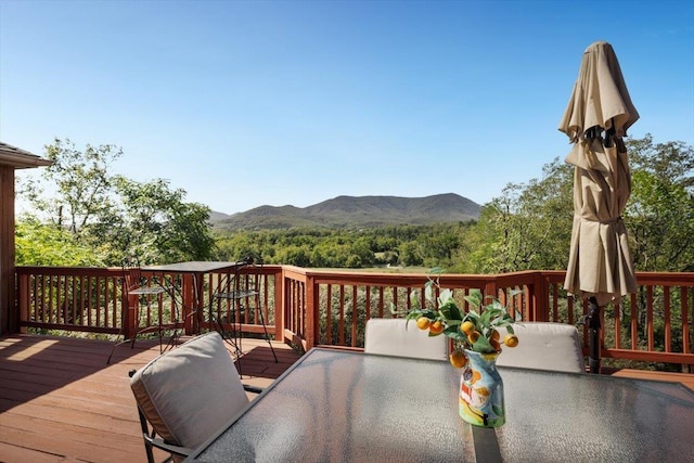 wooden terrace featuring a mountain view